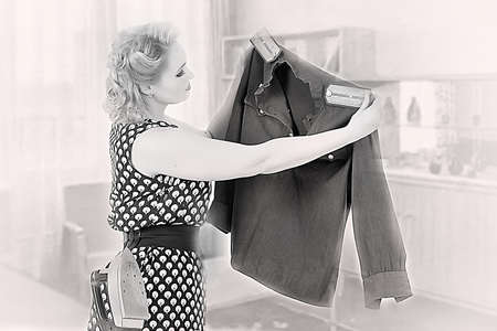 the young girl irons a soldier s blouseの写真素材