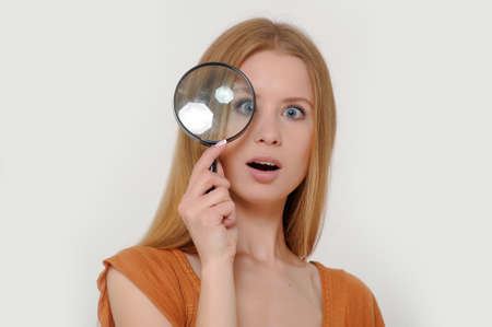 Woman Holding Magnifying Glassの写真素材