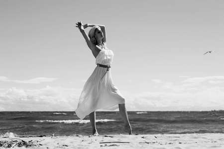 Young woman on the beach in summerの写真素材