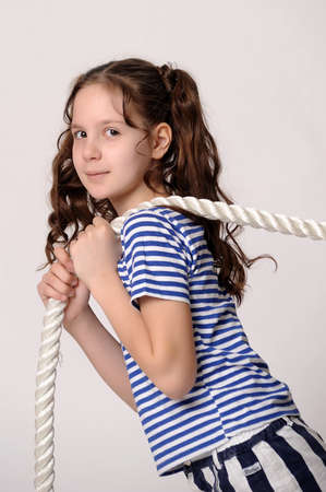 Little girl with a ropeの写真素材