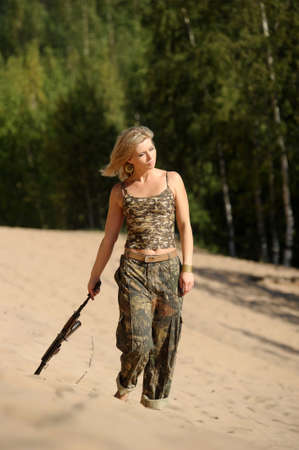 Woman with rifleの写真素材