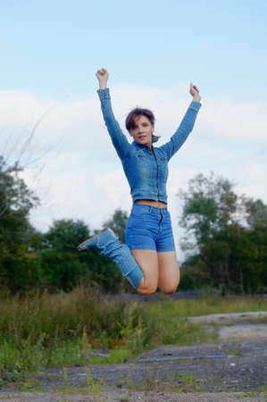 girl in a denim jacket and shorts