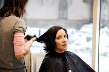 young woman in a hair studioの写真素材