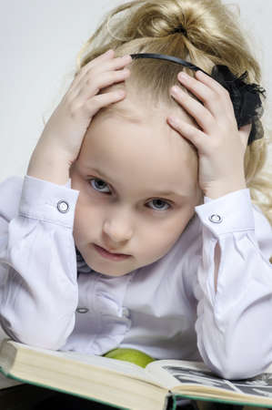 schoolgirl girl clutching his headの写真素材