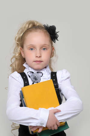 schoolgirl girl with a books in handsの写真素材