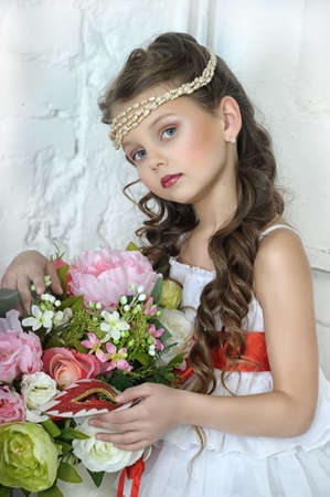 portrait of little girl with flowersの写真素材