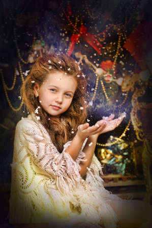 portrait of girl with snowflakes on hairの写真素材