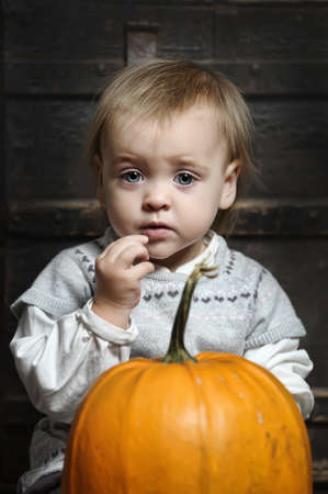 Halloween baby with pumpkins