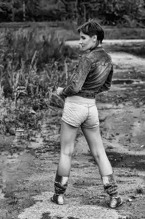 girl in a denim jacket and shortsの写真素材