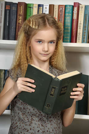 girl with a book in a library