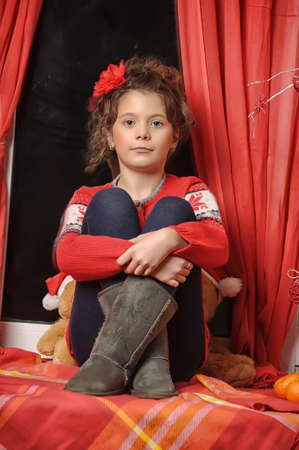  Portrait of a young girl in a red sweaterの写真素材