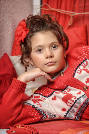  Portrait of a young girl in a red sweaterの写真素材