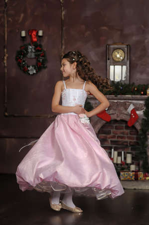 girl in a pink dress stylish retroの写真素材