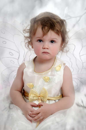Little girl with butterfly s wingsの写真素材