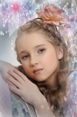 Retro style girl with a flower in the curlsの写真素材