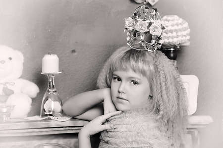 young princess wearing a crown of flowers