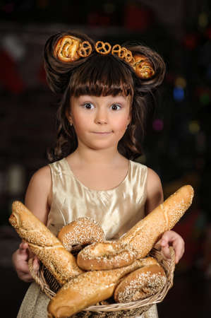 Girl with bread rollsの写真素材