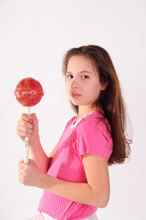The girl with very big sugar candy の写真素材
