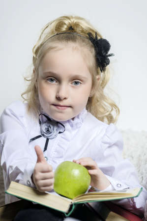 girl with a book and an apple