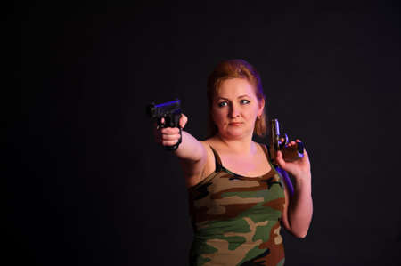 middle-aged woman with a gun