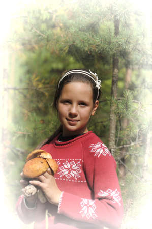 girl with mushrooms in the handsの写真素材