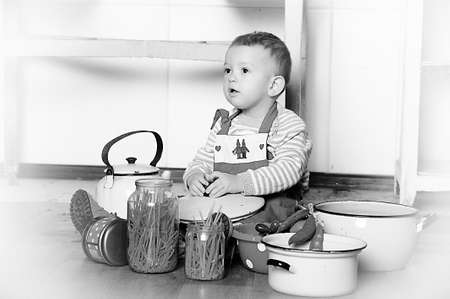 little boy in the kitchenの写真素材