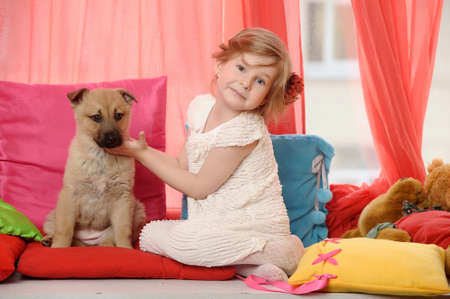 little girl with a puppyの写真素材