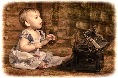 little girl with a typewriterの写真素材