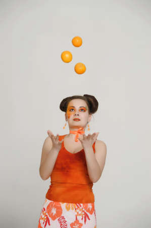 girl with orangesの写真素材