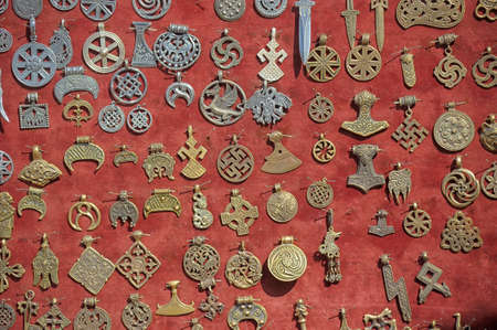 Ancient pagan decoration on a red clothの写真素材