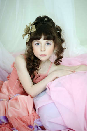 Little, cute girl wearing pink dress.の写真素材