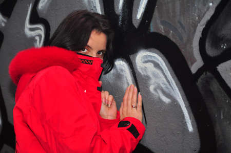 Young girl in the yard, and graffitiの写真素材