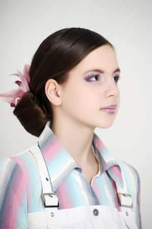 girl with beautiful hairstyle with orchid in her hairの写真素材