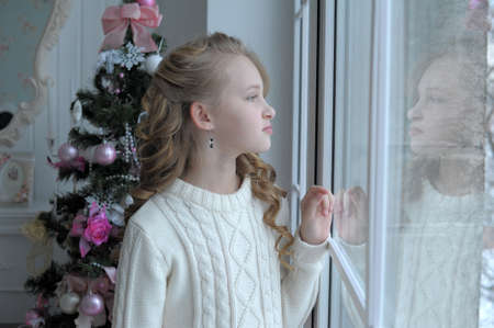 girl at the window Christmasの写真素材
