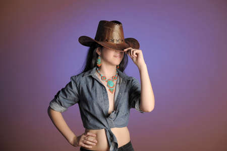 Young girl wearing cowboy hatの写真素材