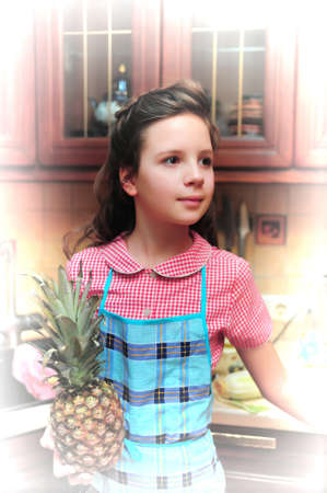 Girl with a pineapple in  handsの写真素材