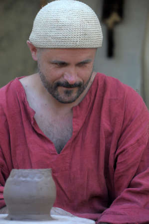 Potter showing his Art Festival on the reconstruction of the early Middle Ages, Volkhov, Russia のeditorial素材