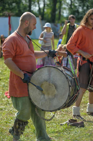 Unidentified musicians in medieval clothes play ancient musical instruments at festival Iron hailstones のeditorial素材