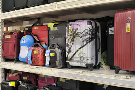 Rack with suitcases in supermarket のeditorial素材