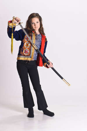 young girl in a Mexican vest, sword in hand