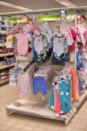 Shelves with baby clothes in large supermarket のeditorial素材
