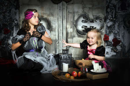 Two little halloween witchesの写真素材