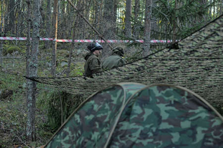 Paintball players in full gear at the shooting range, tournament in St  Petersburg, Russia のeditorial素材