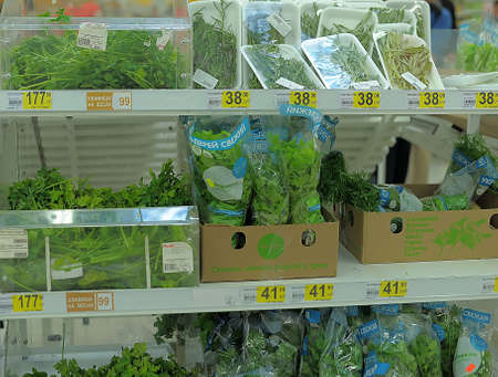 Fresh greens and lettuce on the counter market のeditorial素材