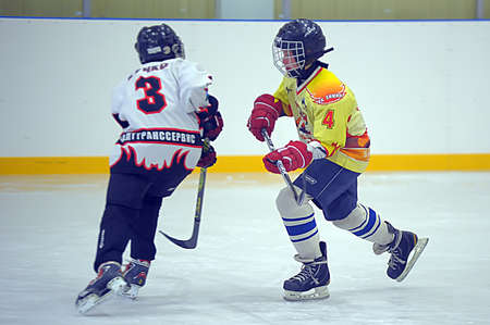 Children playing hockey on a city tournament St  Petersburg, Russia のeditorial素材