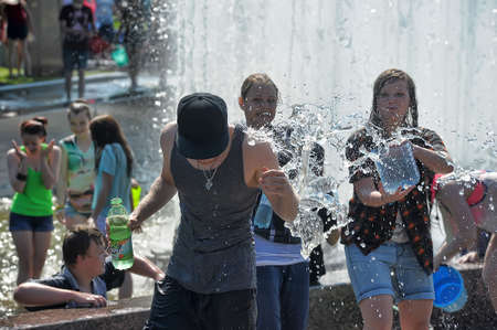 People pour water on each otherのeditorial素材