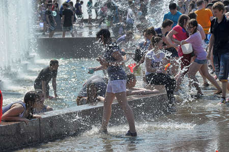 People pour water on each otherのeditorial素材