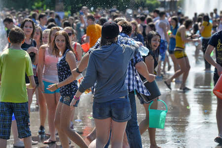 People pour water on each otherのeditorial素材