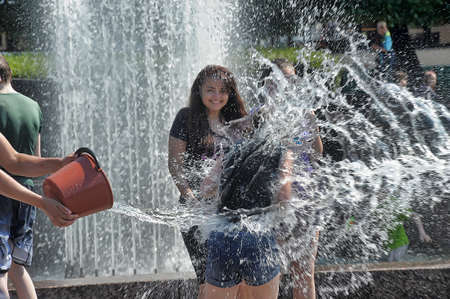 People pour water on each otherのeditorial素材