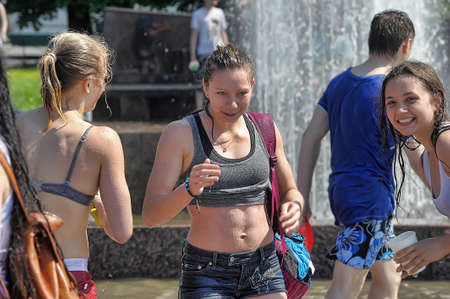 People pour water on each otherのeditorial素材